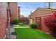 Well-maintained backyard with lawn, landscaping, and storage shed offering a private outdoor space at 1717 E 22Nd Ave, Denver, CO 80205