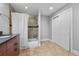 Bright bathroom featuring tiled shower/tub combo, neutral walls and flooring, with ample storage at 1717 E 22Nd Ave, Denver, CO 80205