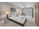 Spacious primary bedroom with hardwood doors and plenty of natural light at 1717 E 22Nd Ave, Denver, CO 80205
