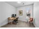 Bright bedroom featuring carpeted floors, a desk, and a window offering natural light at 1717 E 22Nd Ave, Denver, CO 80205