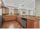 Well-appointed kitchen with wooden cabinets, stainless appliances, and open layout at 1717 E 22Nd Ave, Denver, CO 80205