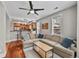 Open-concept living space with hardwood floors, comfortable seating, and kitchen views at 1717 E 22Nd Ave, Denver, CO 80205