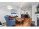 Inviting living room with hardwood floors, comfortable armchairs, and stylish decor at 1717 E 22Nd Ave, Denver, CO 80205