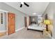 Large main bedroom with wood doors, plush carpet, and gray walls at 1717 E 22Nd Ave, Denver, CO 80205