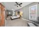 Large main bedroom with wood doors, plush carpet, and a comfortable seating area at 1717 E 22Nd Ave, Denver, CO 80205