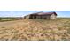 A barn featuring a maroon roof at 1212 N County Road 125, Bennett, CO 80102