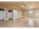 Expansive bedroom with vaulted ceilings, a ceiling fan, and ample natural light from a window at 1212 N County Road 125, Bennett, CO 80102