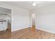 Bright bedroom with hardwood floors and neutral walls, offering a versatile living space at 1212 N County Road 125, Bennett, CO 80102