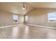 Spacious bedroom featuring large windows and vaulted ceilings allowing an abundance of natural light at 1212 N County Road 125, Bennett, CO 80102