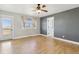 Spacious primary bedroom with neutral walls, ensuite door, and plenty of natural light from large windows at 1212 N County Road 125, Bennett, CO 80102