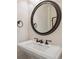 Elegant powder room with a pedestal sink, designer mirror, and stylish fixtures at 1212 N County Road 125, Bennett, CO 80102