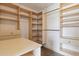 Spacious walk-in closet with built-in shelves and ample storage for an organized wardrobe at 1212 N County Road 125, Bennett, CO 80102