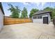 Large backyard with a detached garage and a long wooden fence for privacy at 4059 Quivas St, Denver, CO 80211