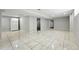 Large finished basement with tile flooring, a refrigerator, and ample space for entertaining at 4059 Quivas St, Denver, CO 80211