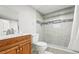 Updated bathroom features tiled shower, modern fixtures, and vanity with sink at 4059 Quivas St, Denver, CO 80211