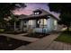 Charming home with a welcoming front porch and beautifully landscaped yard at 4059 Quivas St, Denver, CO 80211