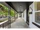 Inviting covered front porch with decorative railings and home number display at 4059 Quivas St, Denver, CO 80211