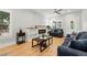 Bright living room with hardwood floors, fireplace, and comfortable seating at 4059 Quivas St, Denver, CO 80211