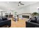 Spacious living room featuring a modern fireplace, hardwood floors, and natural light at 4059 Quivas St, Denver, CO 80211