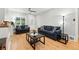 Cozy living room with hardwood floors, stylish furniture, and ample natural light at 4059 Quivas St, Denver, CO 80211