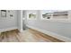 Bright mud room with wood floors, a utility sink, and a view to the outside at 4059 Quivas St, Denver, CO 80211