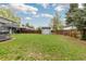 Spacious backyard featuring a well-maintained lawn, shed, and wood fence at 8506 Eaton St, Arvada, CO 80003