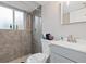 Clean, updated bathroom boasts modern tile shower, sleek vanity, and storage at 8506 Eaton St, Arvada, CO 80003