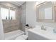 Tastefully designed bathroom featuring tiled shower, modern fixtures, and ample natural light at 8506 Eaton St, Arvada, CO 80003