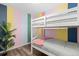 Colorful bedroom featuring a charming bunk bed and bright, playful accents at 8506 Eaton St, Arvada, CO 80003