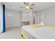 Bedroom featuring ceiling fan, plush carpet and a dedicated workspace with desk and chair at 8506 Eaton St, Arvada, CO 80003