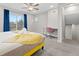 Stylish bedroom features a ceiling fan, plush carpet and a dedicated workspace with a desk and chair at 8506 Eaton St, Arvada, CO 80003