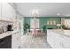 Eat-in kitchen with granite counters, stainless appliances, and sliding glass doors to outdoor living at 8506 Eaton St, Arvada, CO 80003