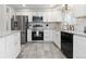 Well-equipped kitchen featuring modern appliances, ample counter space, and stylish finishes at 8506 Eaton St, Arvada, CO 80003
