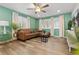 Inviting living room with hardwood floors, ample light, and comfortable seating at 8506 Eaton St, Arvada, CO 80003