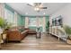 Inviting living room with hardwood floors, ample light, and comfortable seating at 8506 Eaton St, Arvada, CO 80003