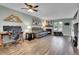 Spacious living room featuring hardwood floors, a fireplace, and a comfortable seating area at 9615 W Chatfield Ave # C, Littleton, CO 80128