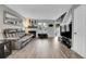 Comfortable living room with a fireplace, gray couch, and plenty of natural light at 9615 W Chatfield Ave # C, Littleton, CO 80128