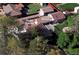 A sprawling property with a main house, carriage house, mature trees, and a private backyard space at 4500 Zephyr St, Wheat Ridge, CO 80033