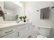Bright bathroom showcasing modern fixtures, neutral color palette, glass shower and lots of natural light at 4500 Zephyr St, Wheat Ridge, CO 80033