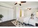 Spacious bedroom with a barn door leading to bathroom and plenty of natural light at 4500 Zephyr St, Wheat Ridge, CO 80033
