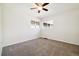 A blank canvas of a bedroom with natural light and neutral carpet at 4500 Zephyr St, Wheat Ridge, CO 80033
