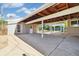 Spacious carport with exposed wood beams and concrete flooring, ideal for parking and outdoor activities at 4500 Zephyr St, Wheat Ridge, CO 80033