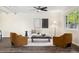 Bright living room with a ceiling fan, wood floors, and modern furnishings at 4500 Zephyr St, Wheat Ridge, CO 80033