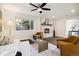 Inviting living room featuring a fireplace, comfortable seating, and natural light at 4500 Zephyr St, Wheat Ridge, CO 80033