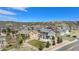 Aerial view of a landscaped backyard, new construction home, and a scenic community at 2516 Mountain Sky Dr, Castle Rock, CO 80104