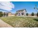 Large backyard features grass, patio, mature trees, and fence at 2516 Mountain Sky Dr, Castle Rock, CO 80104