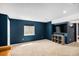 Finished basement featuring plush carpeting, a large window, and a TV at 2516 Mountain Sky Dr, Castle Rock, CO 80104