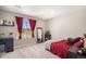 Bedroom with a large window featuring red curtains and plush carpeting at 2516 Mountain Sky Dr, Castle Rock, CO 80104