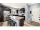 Well-lit kitchen with stainless appliances, granite countertops, and a convenient breakfast bar at 2516 Mountain Sky Dr, Castle Rock, CO 80104