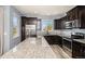 Modern kitchen with stainless steel appliances, granite countertops, and ample cabinet space at 2516 Mountain Sky Dr, Castle Rock, CO 80104